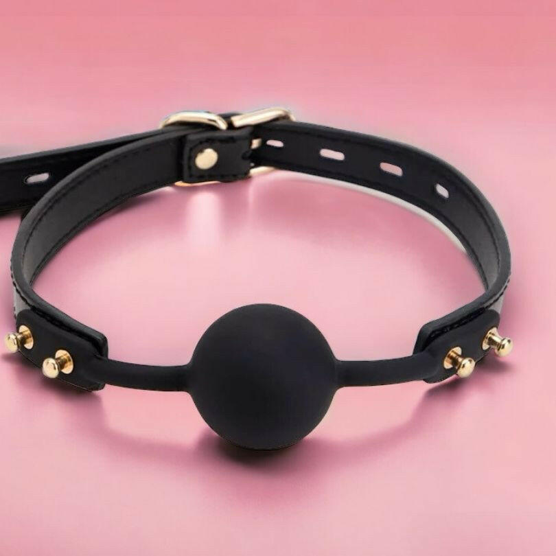 Playful black and gold sexy ball gag for kinky play by kinki couture 