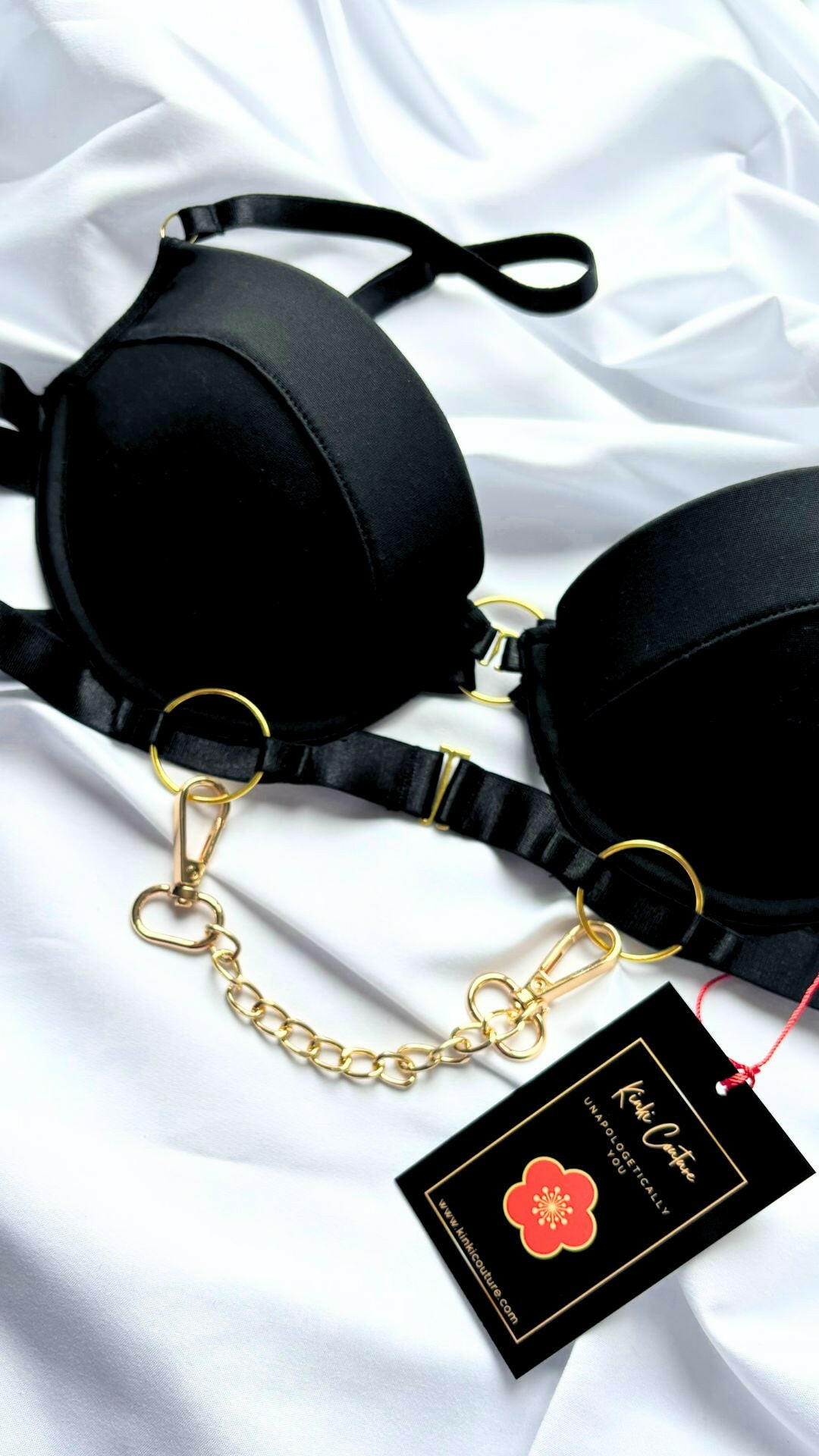 Black padded bra with front fastening gold chain by Kinki couture 